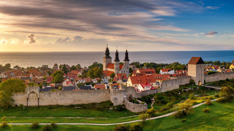 City walls, cathedral, and medieval architecture of Visby with sea in the background