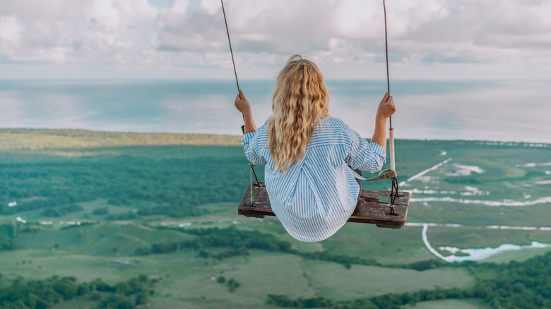 Girl swinging off Montaña Redonda