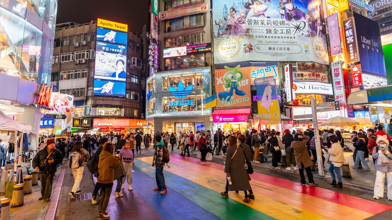 Pedestrians at a rainbow crosswalk in Ximending Night Market