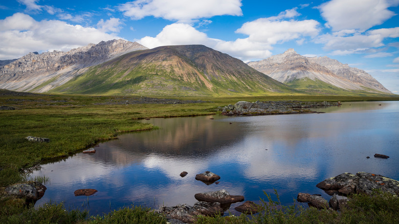 Alaskan mountains and lake blue skey