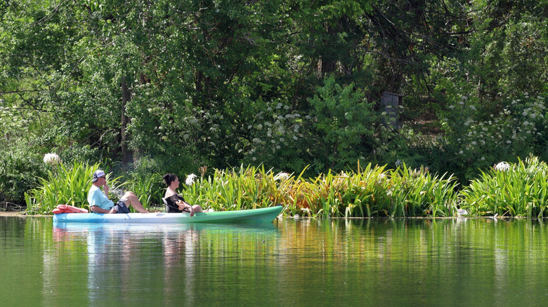 two people in a kayak on a river in Texas