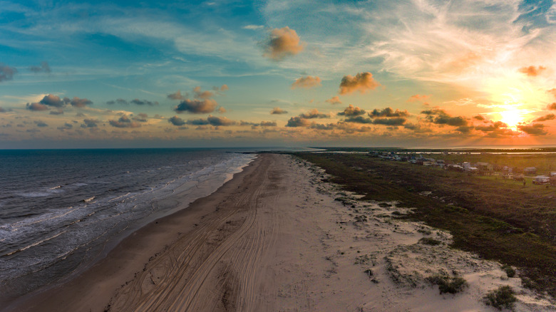 the shoreline of Matagorda Bay, Texas at sunset