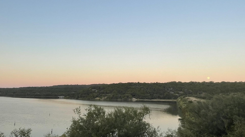 Sunrise and moonset over Tucker Lake.