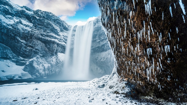 Skogafoss waterfall in winter with snow