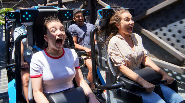 Riders on Jurassic World VelociCoaster