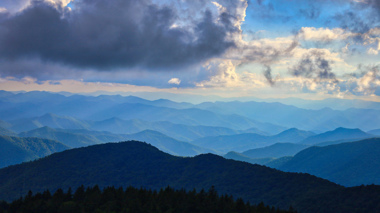 Deep layers of the Blue Ridge Mountains under a cloudy blue sky near Ashville, North Carolina