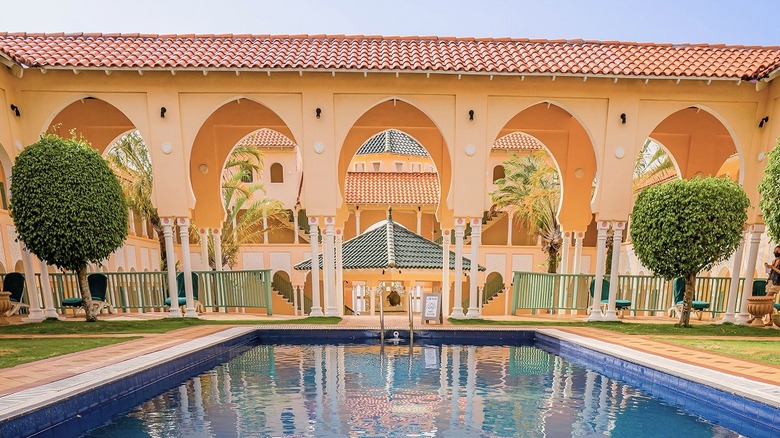 Pool and archway at The BodyHoliday St. Lucia
