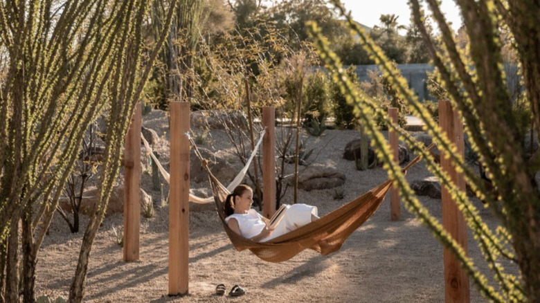 woman sits in a hammock at Civana Wellness Resort and Spa