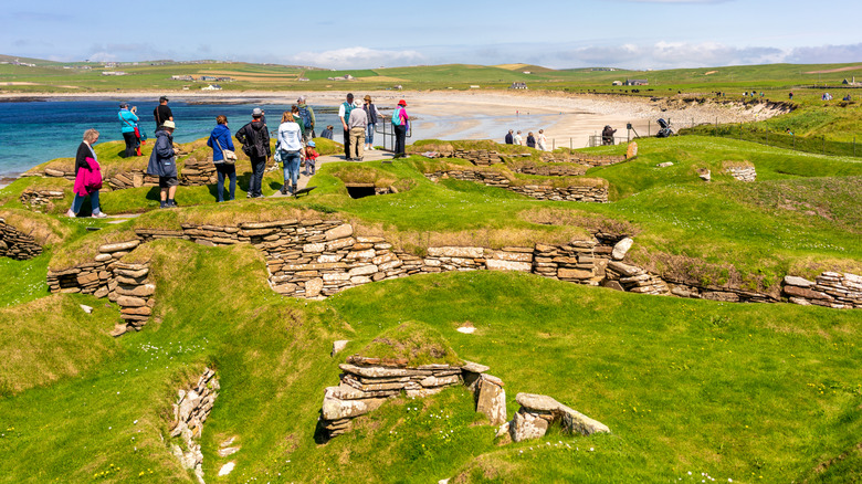 tourists visiting Skara Brae