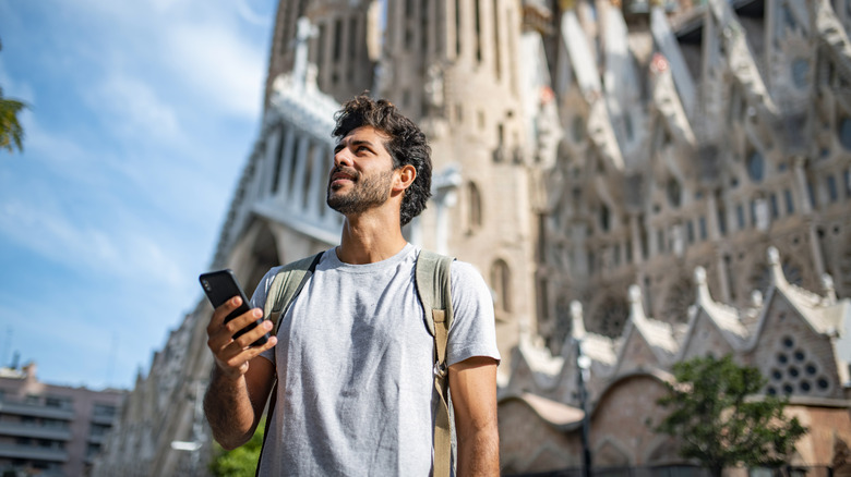 Traveler holding his phone 