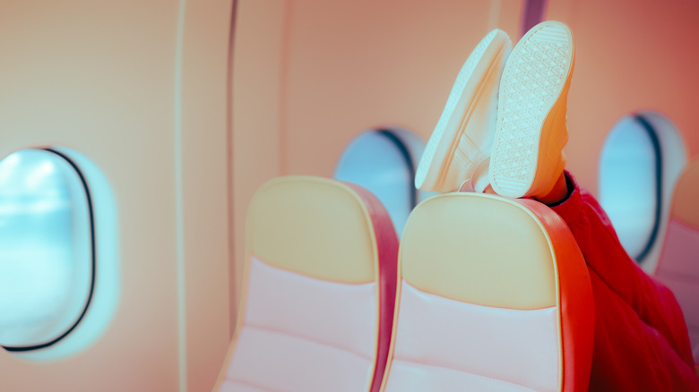 Shoes on an airplane headrest