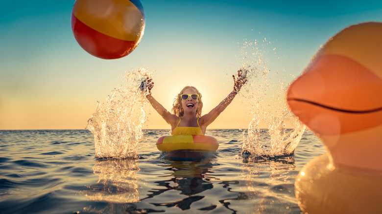 Kid playing in the ocean