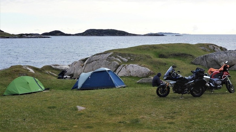 tents and motorcycles by sea
