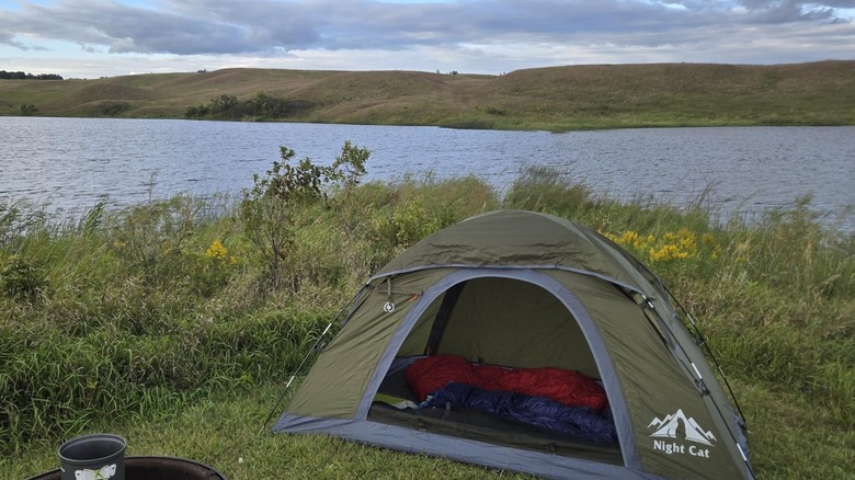 Night Cat backpacking tent set up near a lake