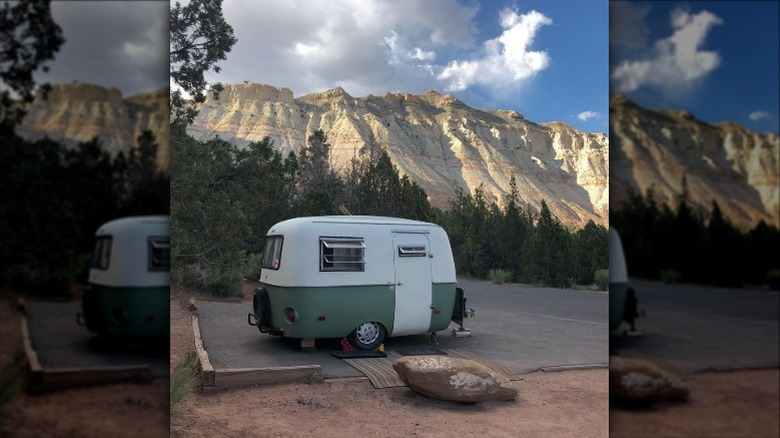 Boler camper with backdrop of mountains