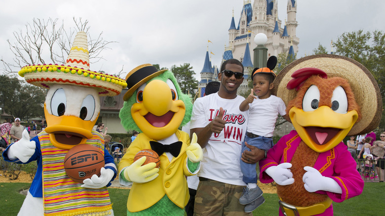 Man and child with Disney characters