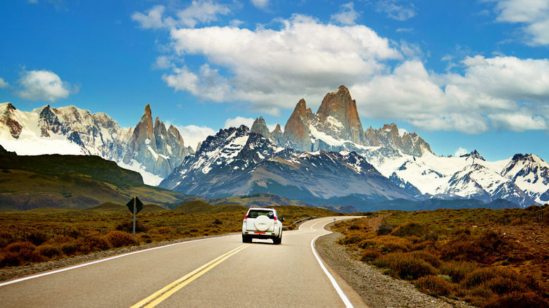 car driving down mountain road