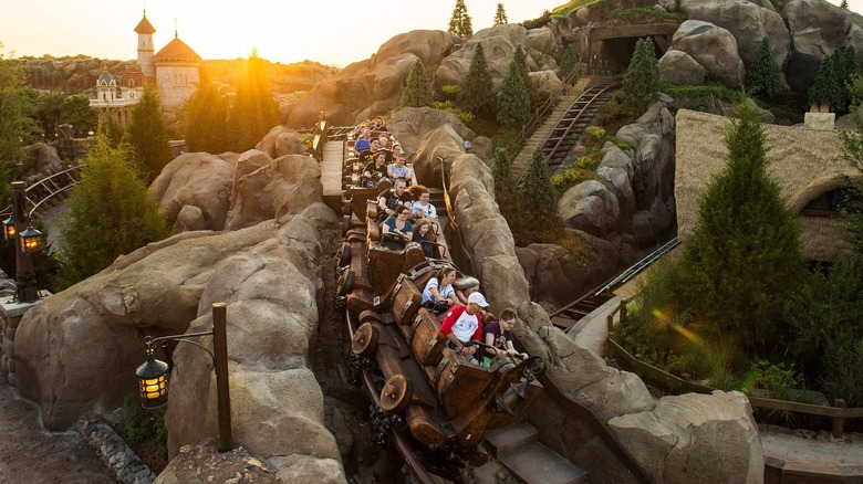 Guests riding Seven Dwarfs Mine Train