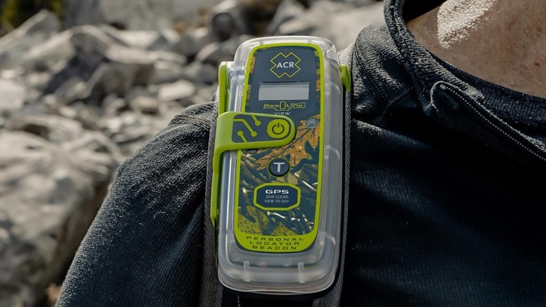The ACR Electronics ResQLink View clipped to a hiker's shoulder