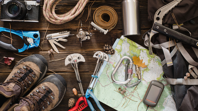 A climber's gear laid out on the floor