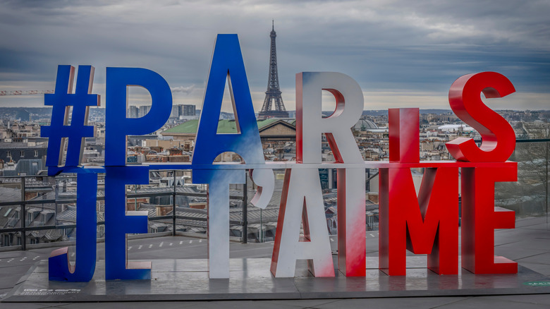 Signage and Eiffel Tower view from Galeries Lafayette Paris Haussmann terrace