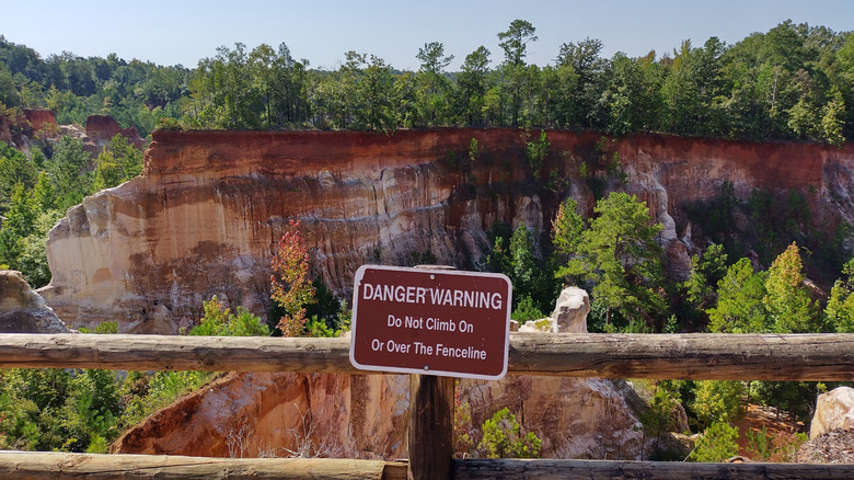 wooden rail marks the path at Providence Canyon State Park in Georgia