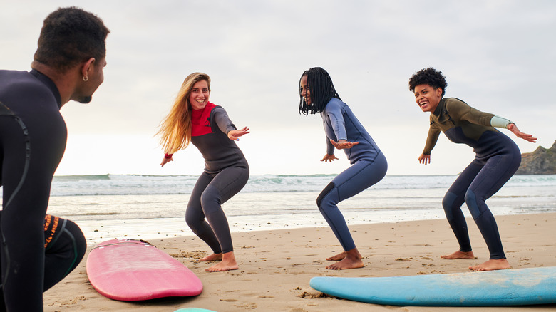 A group learning to surf