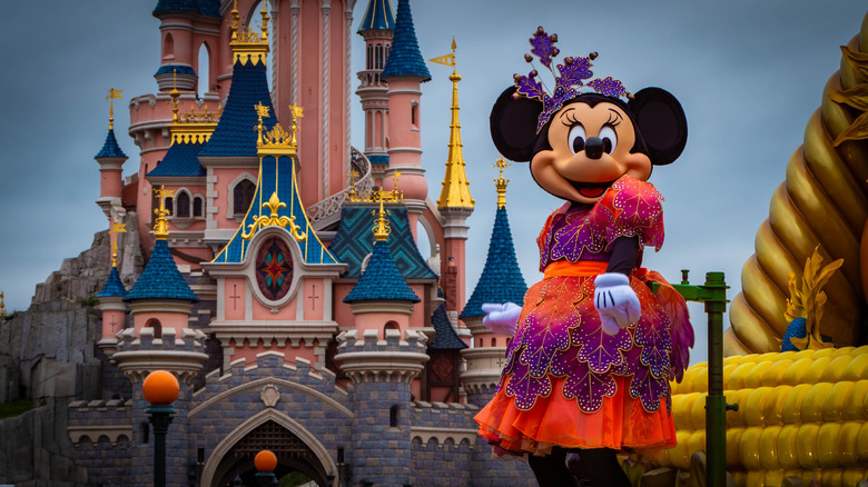 Halloween Minnie in front of the castle at Disneyland Paris.