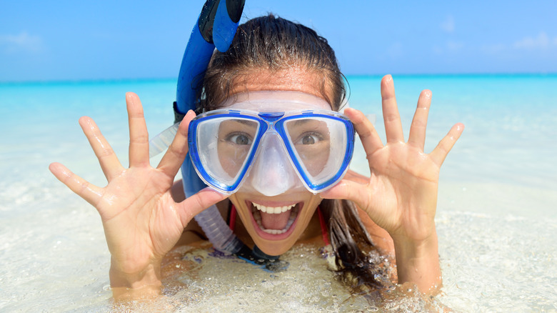 Woman wearing a snorkel in the water