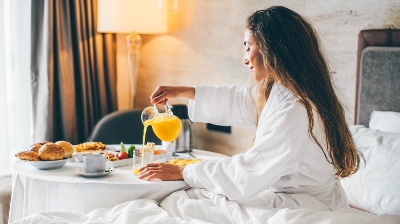 Woman having breakfast in bed