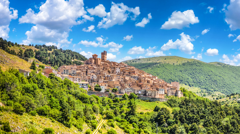 A scenic Italian village on top of green rolling hills