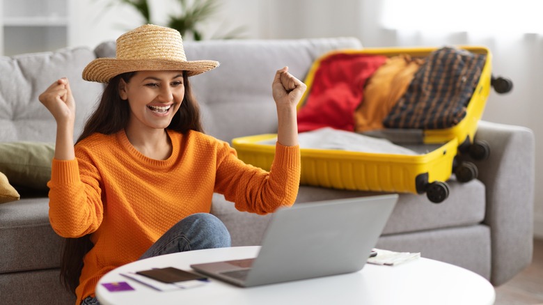 Woman in hat at computer