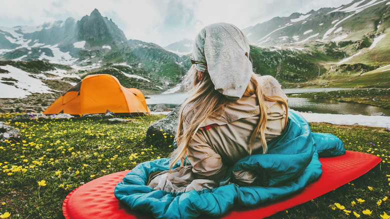 woman laying in sleeping bag