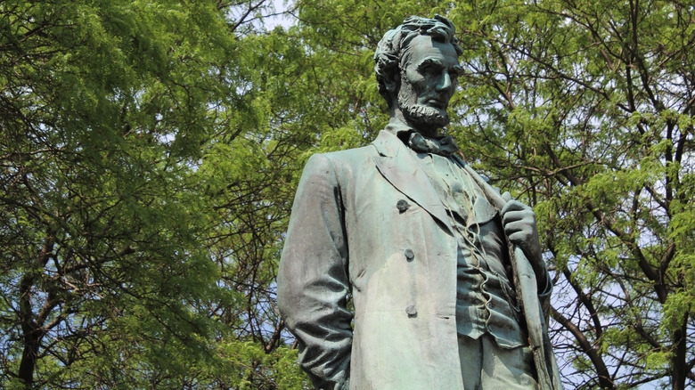 Standing Lincoln statue green leaves Chicago