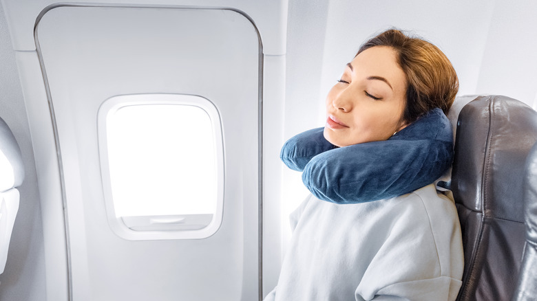 woman asleep on a plane