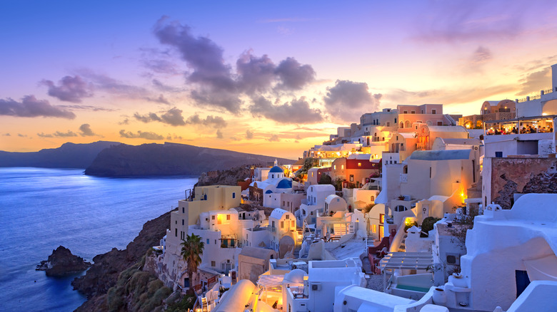 Sunset by Santorini white houses
