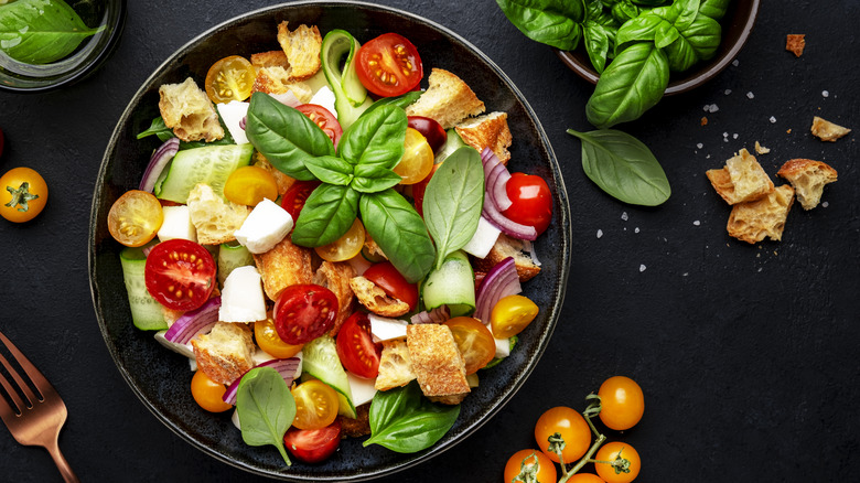 Italian salad on black table