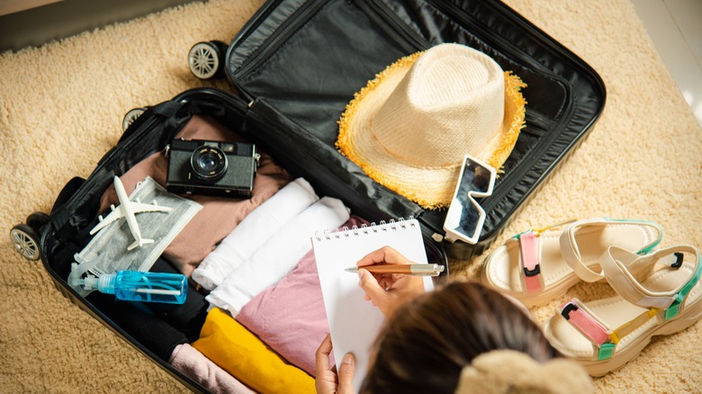 girl packing luggage