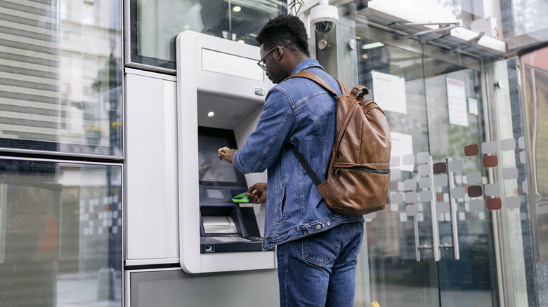 traveler at a foreign atm