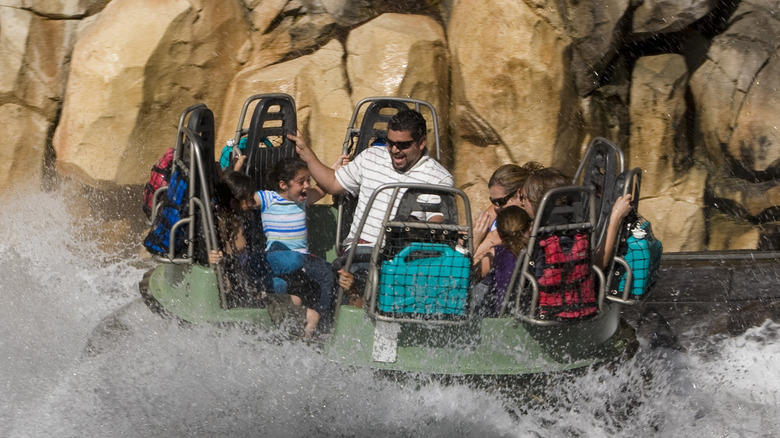 A family riding Grizzly River Run at Disneyland.