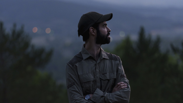 ranger standing outside in evening