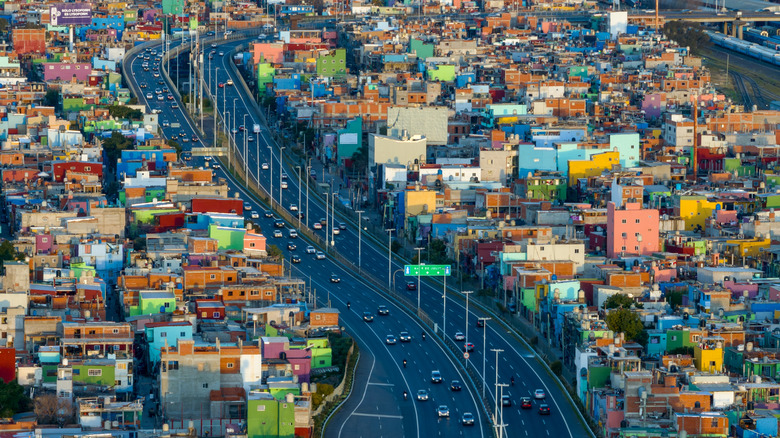 Highway road surrounded by colorful houses