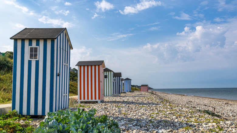 Colorful beach huts line the Danish coast