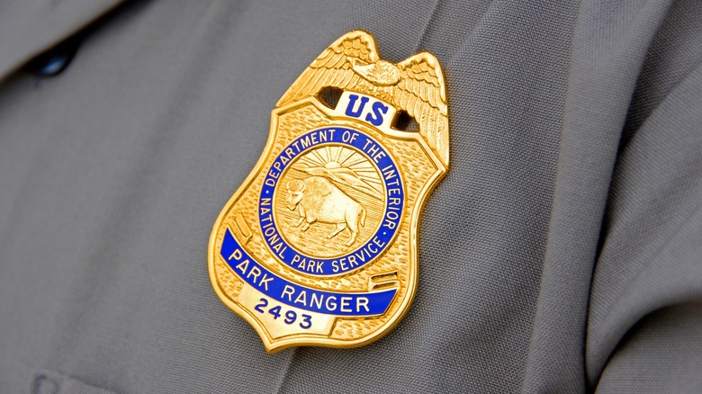 Close-up of park ranger badge