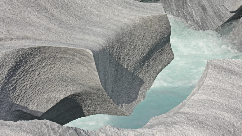 textured sculpted marble near river