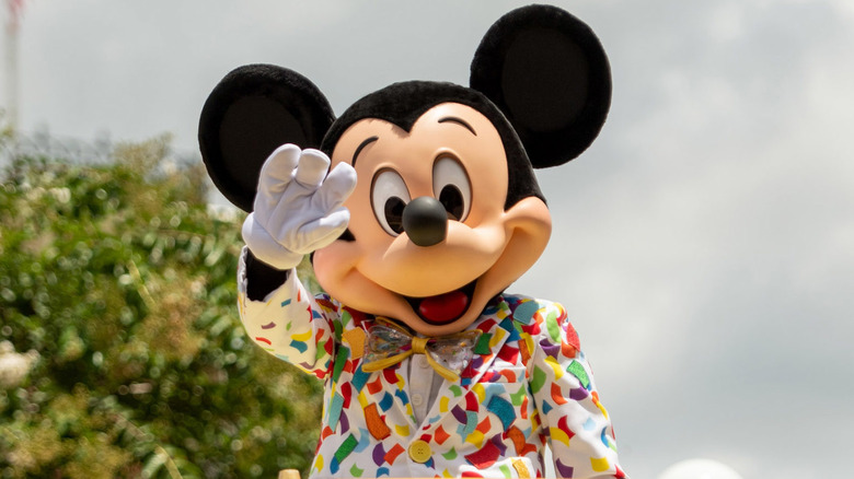 Mickey Mouse waving to guests