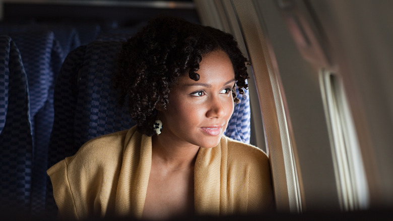 Woman sitting in a plane