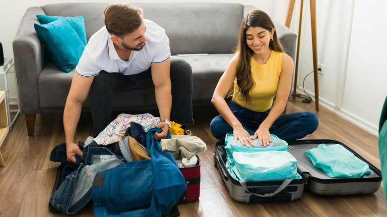 man and woman packing 