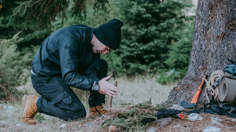 Man starting a campfire