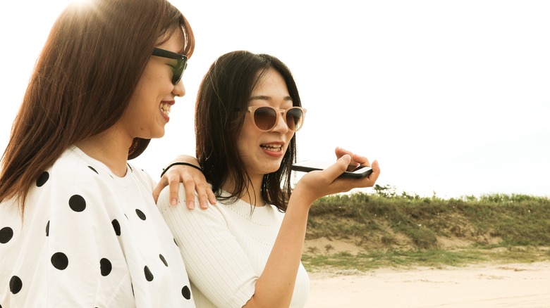 Women speaking into phone